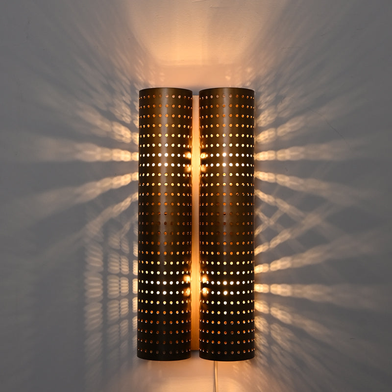 Honeycomb shadowed hollowing rolled steel sconce